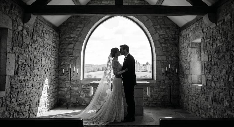 wedding, couple, silhouette, kiss, chapel, stone, altar, candles, romance, bride, groom, window, arch, marriage, ceremony, intimate, love, gown, suit, landscape, timeless